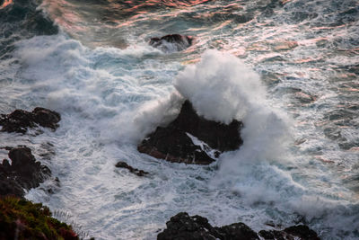 Waves splashing on rocks