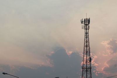 Low angle view of communications tower against sky