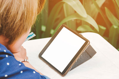 Close-up of girl using mobile phone