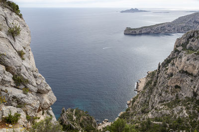 High angle view of rocks by sea