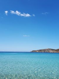 Scenic view of sea against blue sky