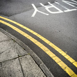 Double yellow line at the edge of the sidewalk