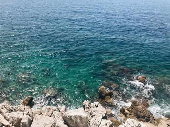 High angle view of rocks in sea