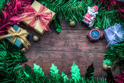 Directly above shot of christmas decorations on wooden table