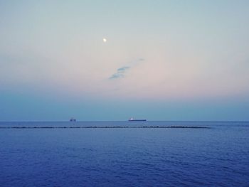 Scenic view of sea against sky at sunset