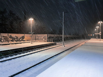 View of illuminated street lights at night