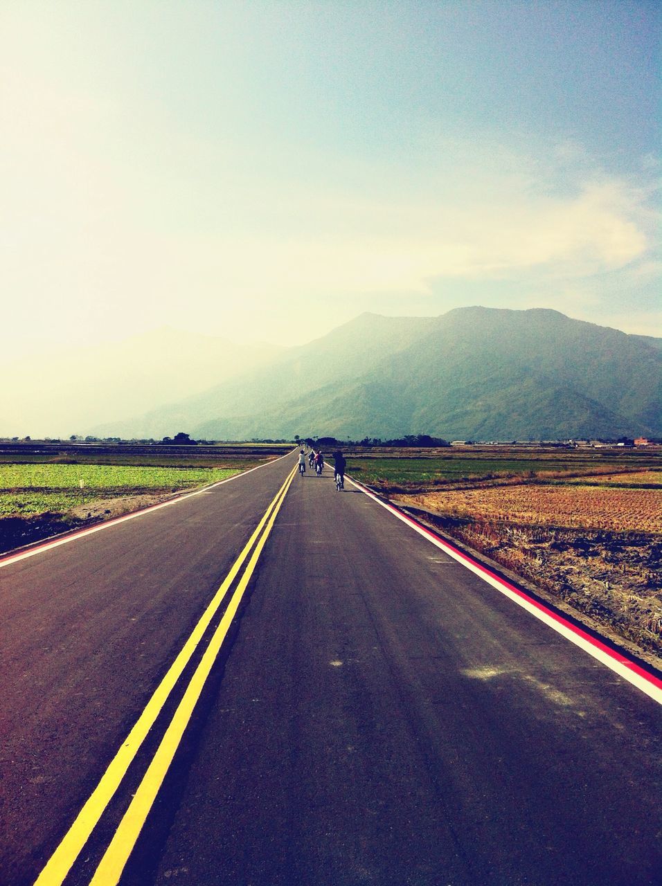 transportation, the way forward, road, road marking, diminishing perspective, country road, vanishing point, landscape, sky, asphalt, mountain, empty, tranquil scene, dividing line, double yellow line, empty road, tranquility, highway, scenics, countryside