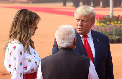 Rear view of couple standing outdoors