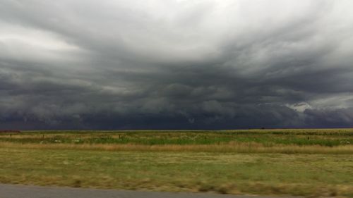 Storm clouds over field