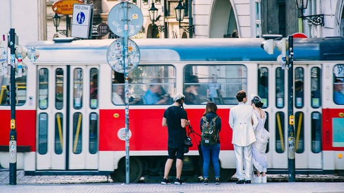 People standing by train