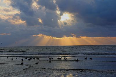 Scenic view of sea against sky at sunset