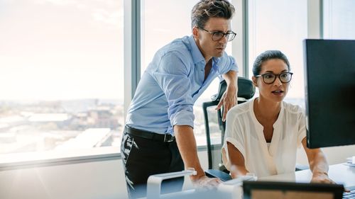 Side view of businesswoman working in office