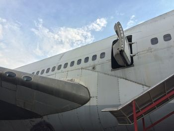 Low angle view of airplane against sky