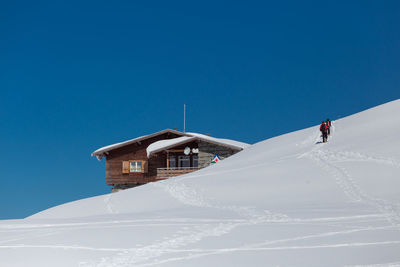 Low angle view of building against clear blue sky