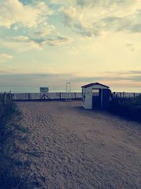 Scenic view of beach against sky during sunset