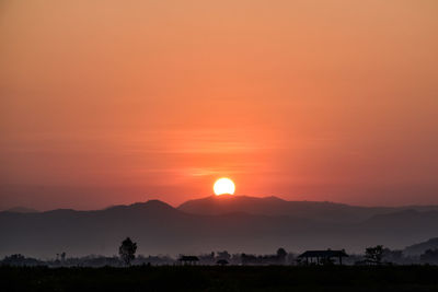 Scenic view of silhouette landscape against sky during sunset