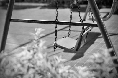 Close-up of empty swing in park