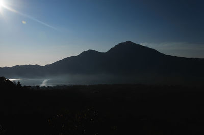 Scenic view of silhouette mountains against sky