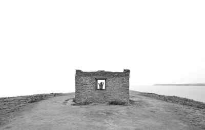 Abandoned building against clear sky