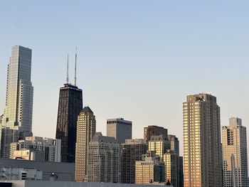 Skyscrapers in city against clear sky