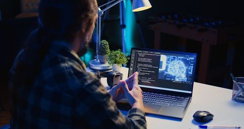 Midsection of woman using laptop