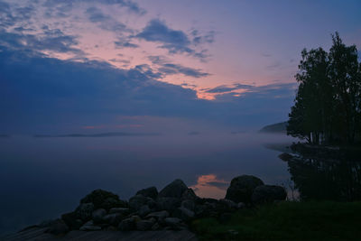 Scenic view of rocks against sky during sunset