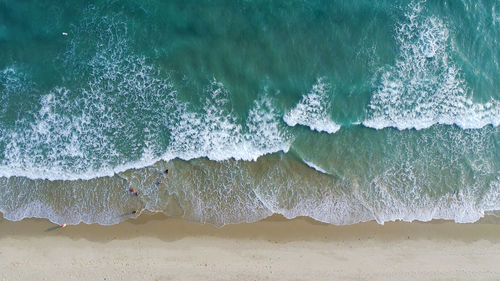 Close-up of waves rushing towards shore