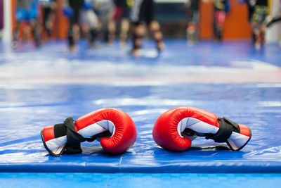 Close-up view of red boxing gloves