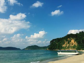 Scenic view of calm sea against cloudy sky