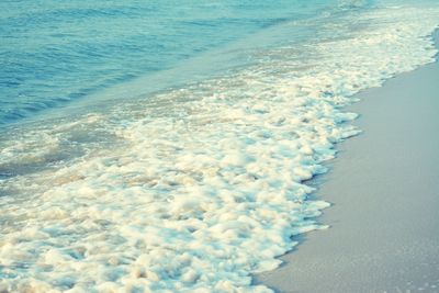 High angle view of surf on beach