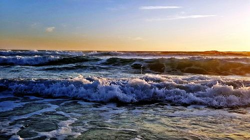 Scenic view of sea at sunset