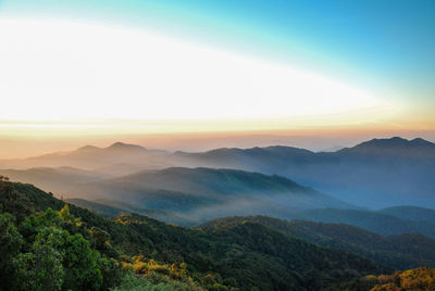 Fog over mountain during sunrise 