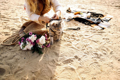 Girl wearing a leash for a cat