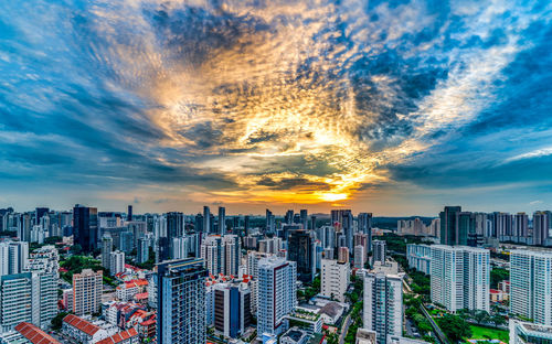 Aerial view of modern buildings in city against sky