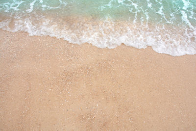 High angle view of surf on beach