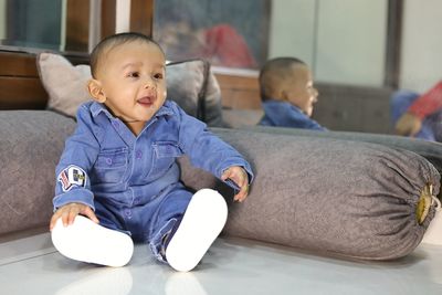 Cute boy sitting at home