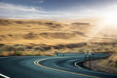 Road against sky during sunset