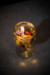 High angle view of illuminated lamp on table