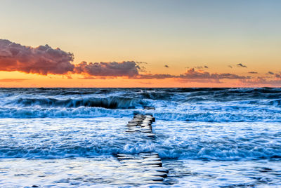 Scenic view of sea against sky during sunset