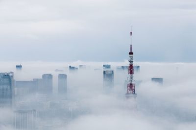 Skyscrapers against cloudy sky