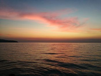 Scenic view of sea against sky at sunset