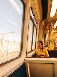 Portrait of man sitting in train