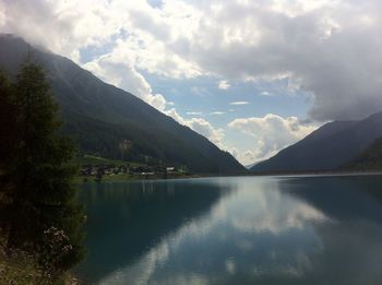 Scenic view of lake and mountains against sky