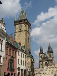 Prague astronomical clock by church of our lady before tyn against sky