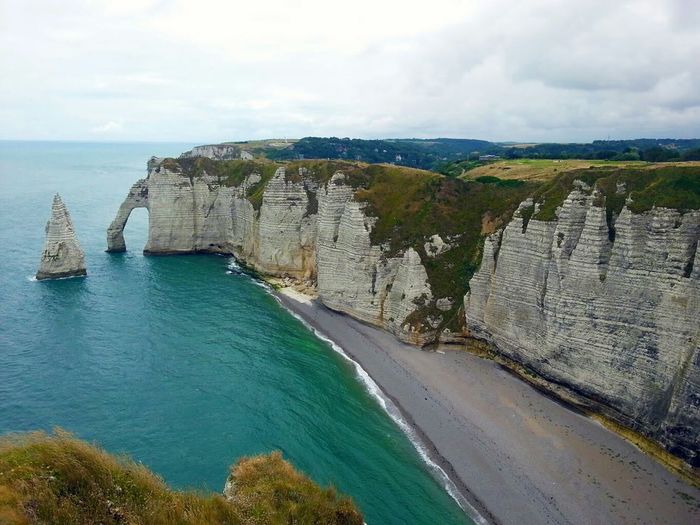 Cliff by sea at etretat