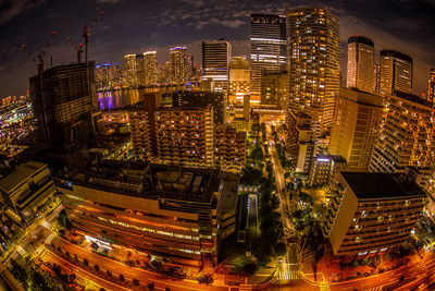 High angle view of illuminated buildings in city at night