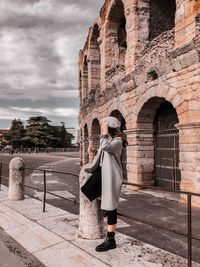 Full length of woman standing against sky