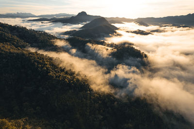 Aerial view of mountains against sky during sunset