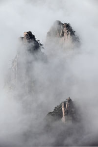 View of mountains during foggy weather