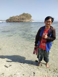 Full length of man standing on beach